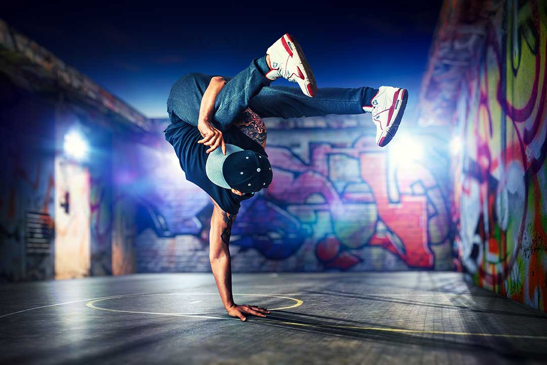 Hip hop breakdancer balanced on one hand