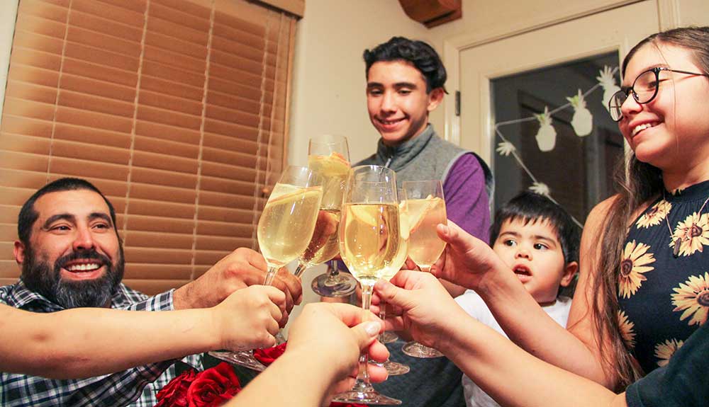 Family clinking champagne glasses