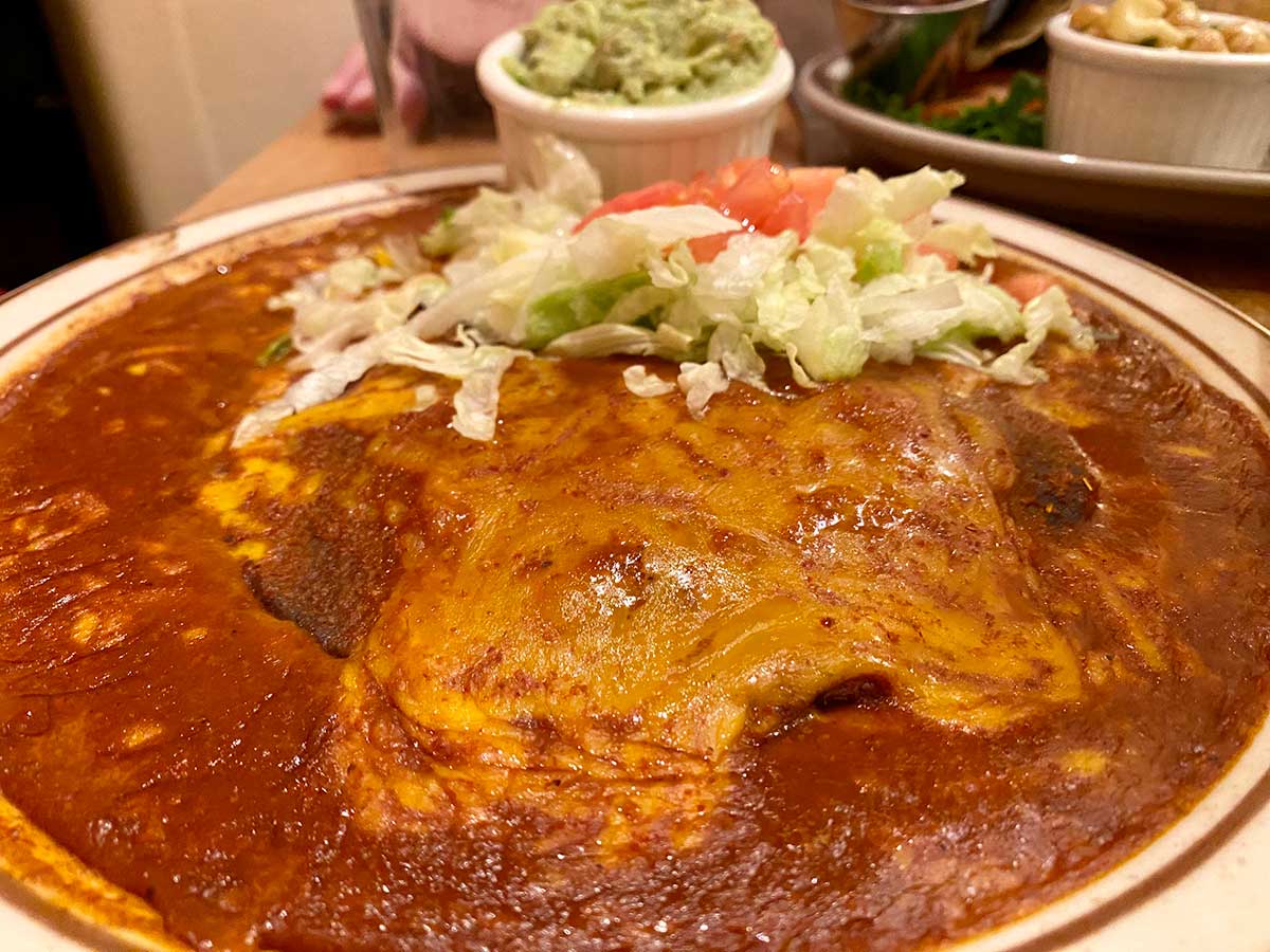 Flat blue corn enchiladas with red sauce is a traditional New Mexican recipe.