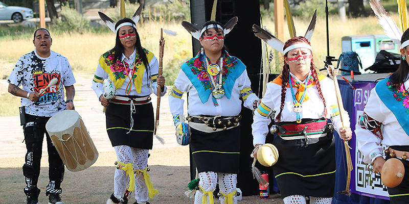 G Precious and Indigenous dancers.