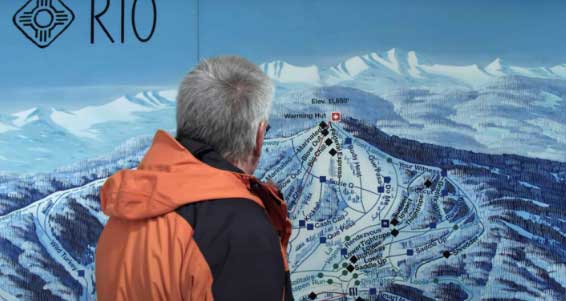 Ski Rio’s caretaker Joe Musich looks over its trail map sign in the base area.