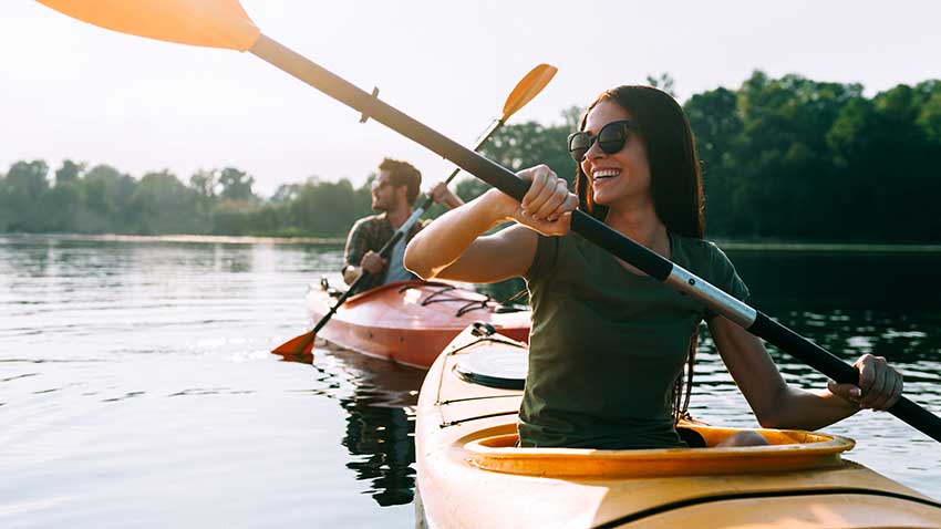 Boat a lake or river with kayaks.