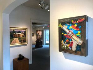 Interior view of Meyer Gallery with paintings.