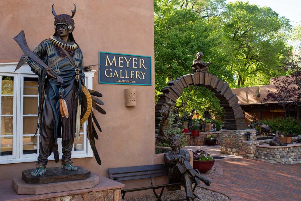 Exterior of Meyer Gallery with two sculptures and sign.