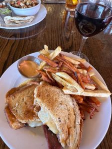 The Reuben with mixed fries and Pollo bowl in the background at Museum Hill Cafe.