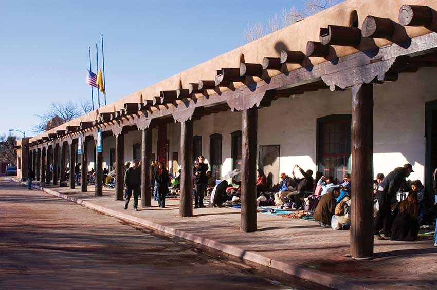 Palace of the Governors Portal. Photo by Blair Clark, NMDCA. The New Mexico History Museum is located at the Palace of the Governors. Here, Indigenous artists are selling their creations.