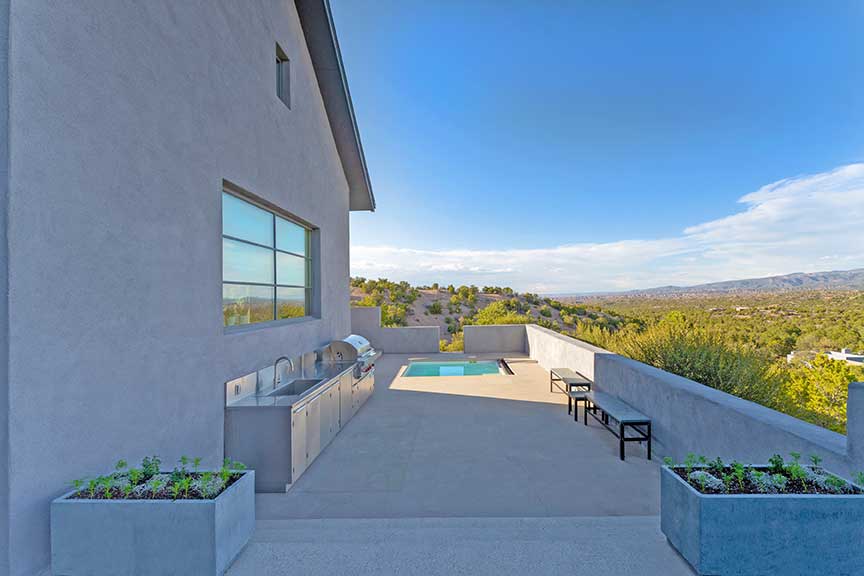 Luxury homes in Santa Fe may include a pool and a view.