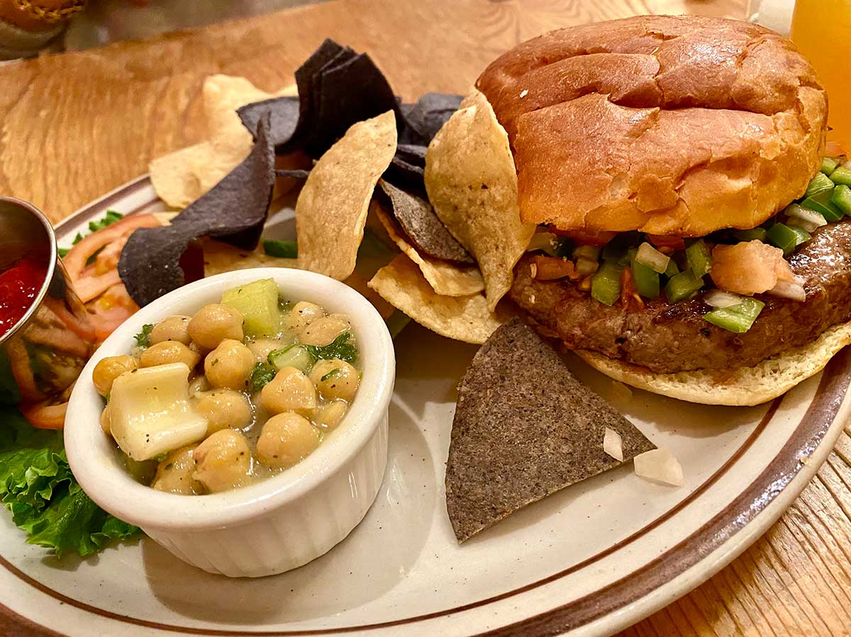 The Shed Burger with chickpea salad and chips