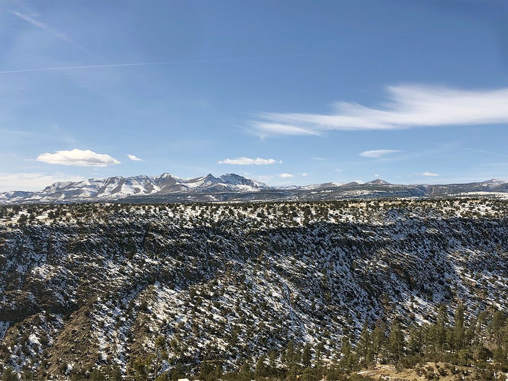overlook of the snowy mountains at White Rock Overlook